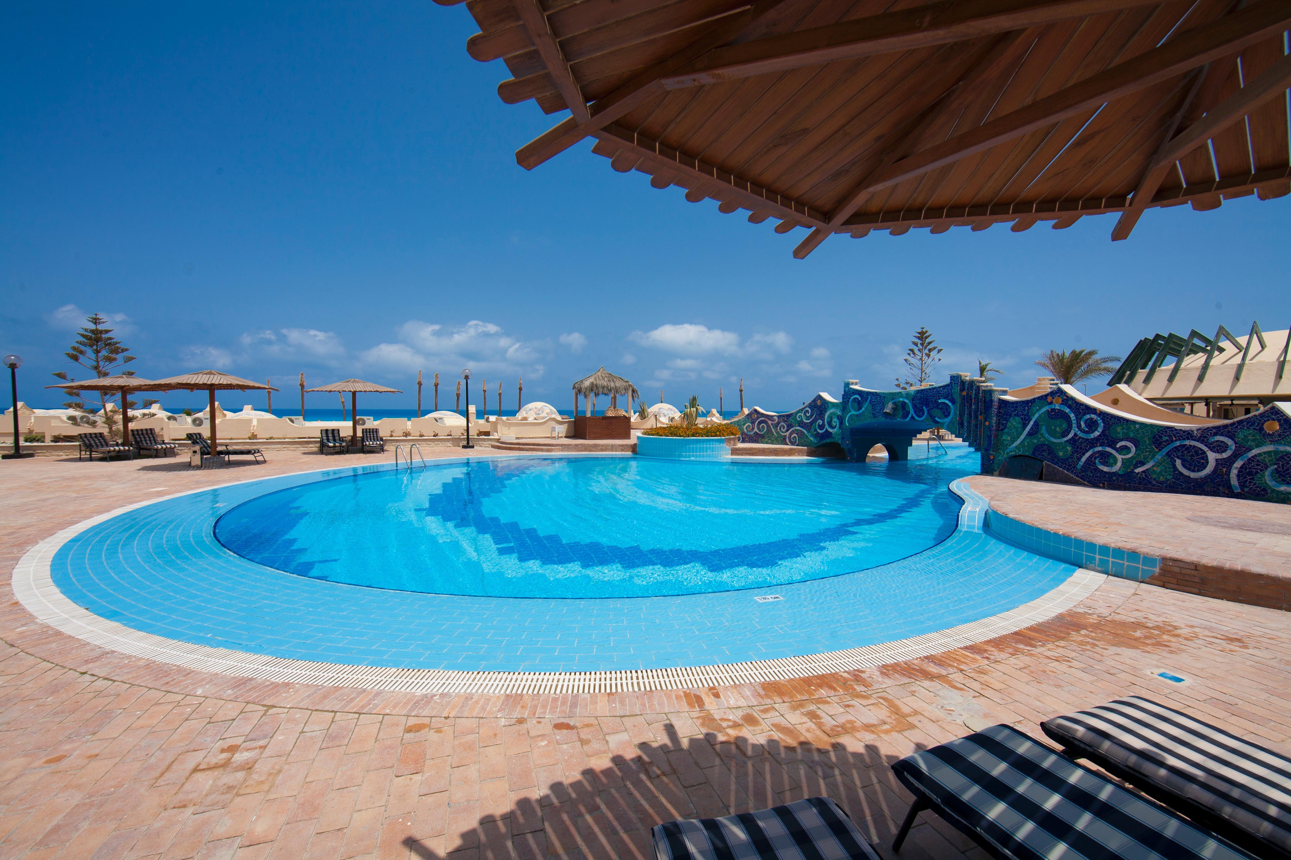 Borg El Arab Beach Resort Extérieur photo The swimming pool at the Dead Sea Spa Magdala