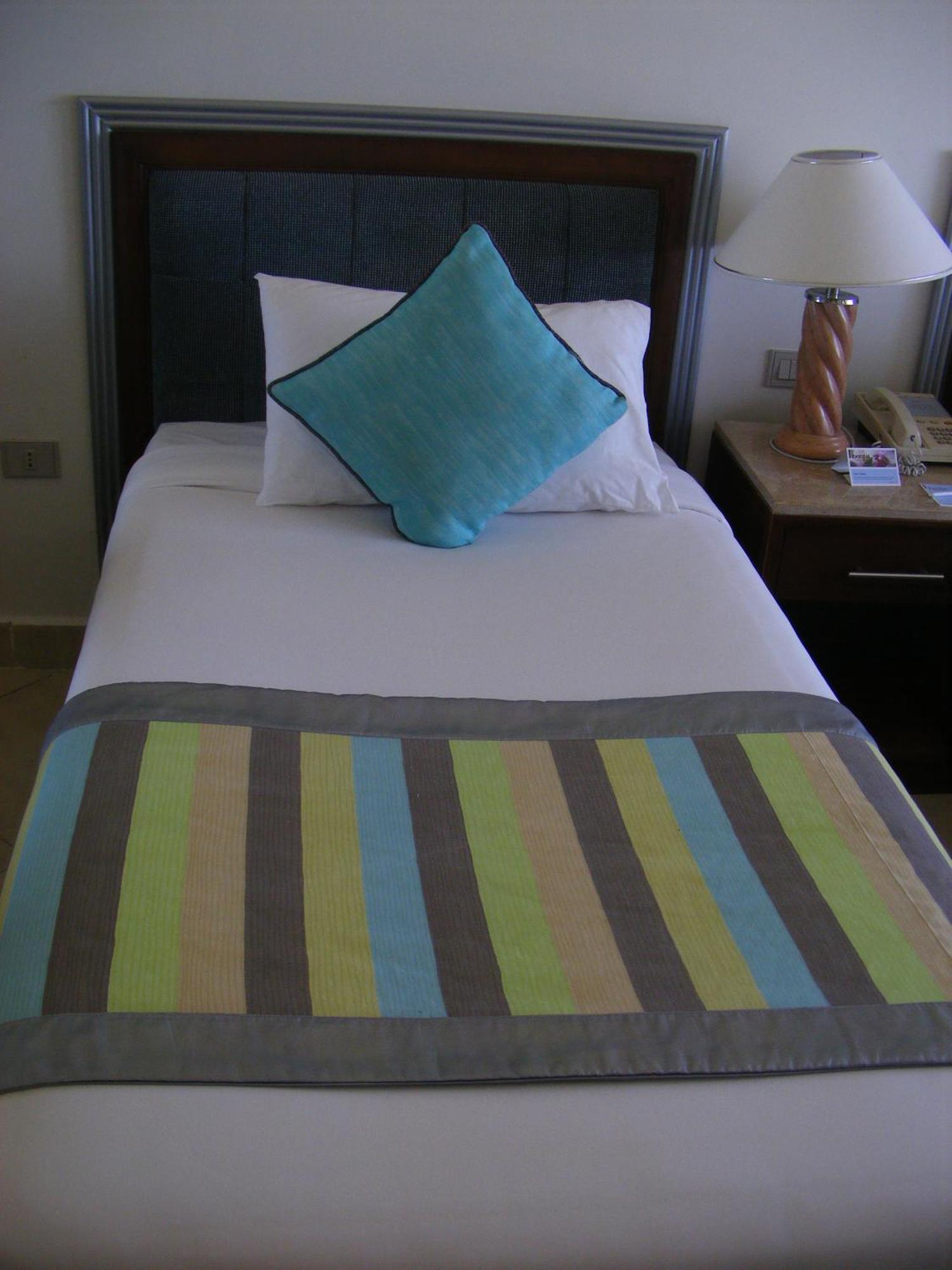 Borg El Arab Beach Resort Extérieur photo A bed with a bed runner