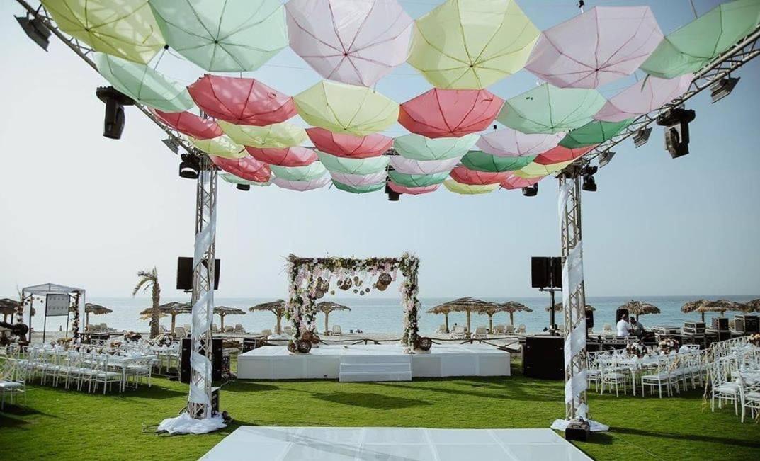 Borg El Arab Beach Resort Extérieur photo A canopy of umbrellas