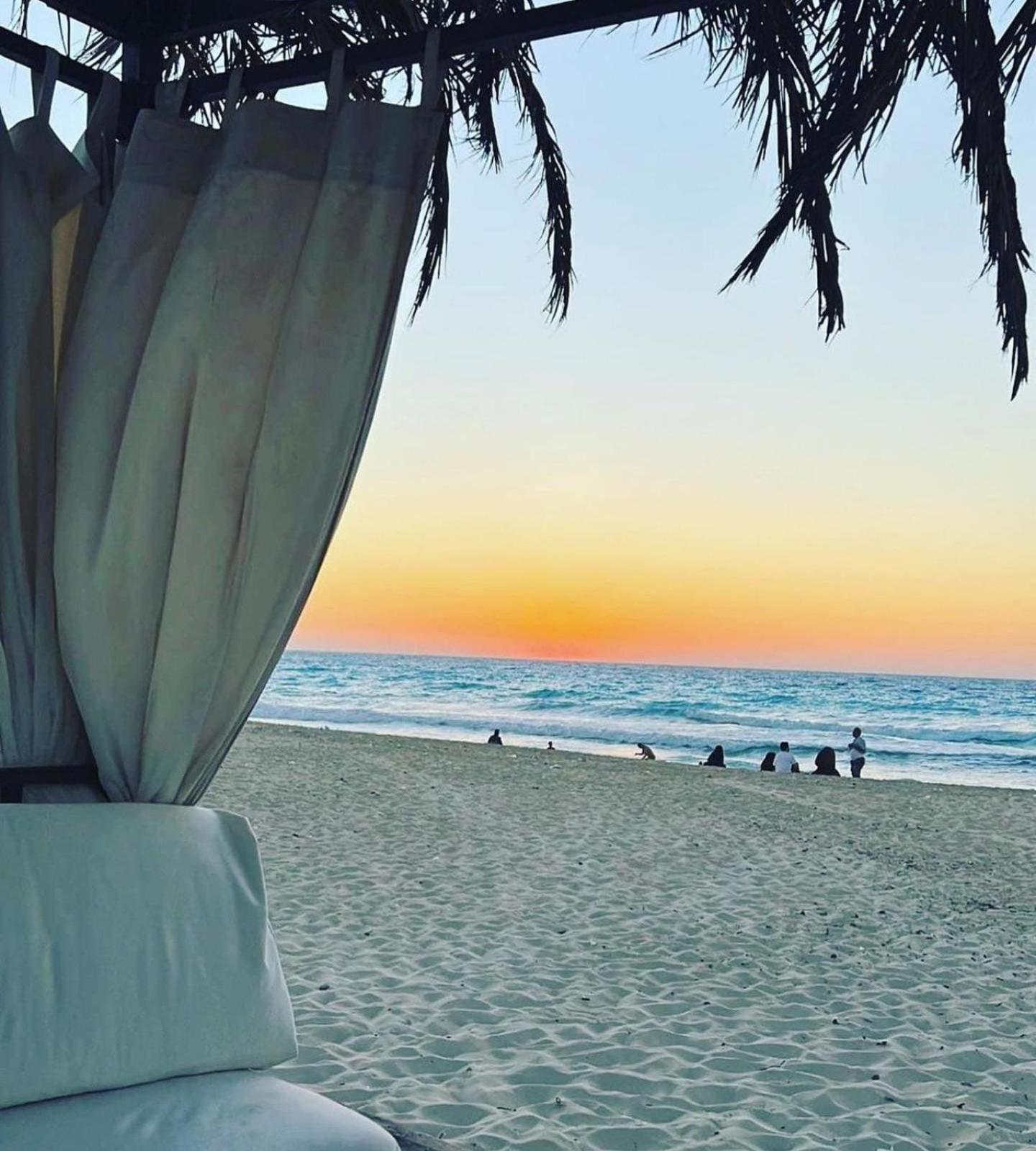 Borg El Arab Beach Resort Extérieur photo Sunset at the beach