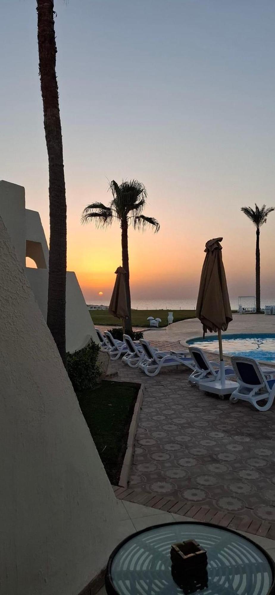 Borg El Arab Beach Resort Extérieur photo Sunset at the hotel